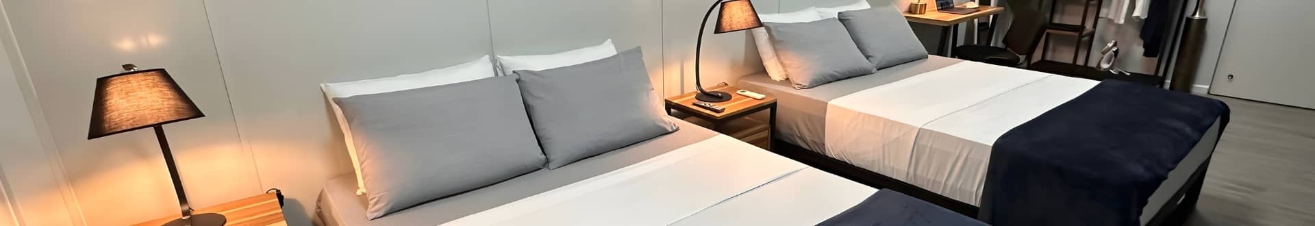 Cozy double Queen beds – Sea Nomads bungalow