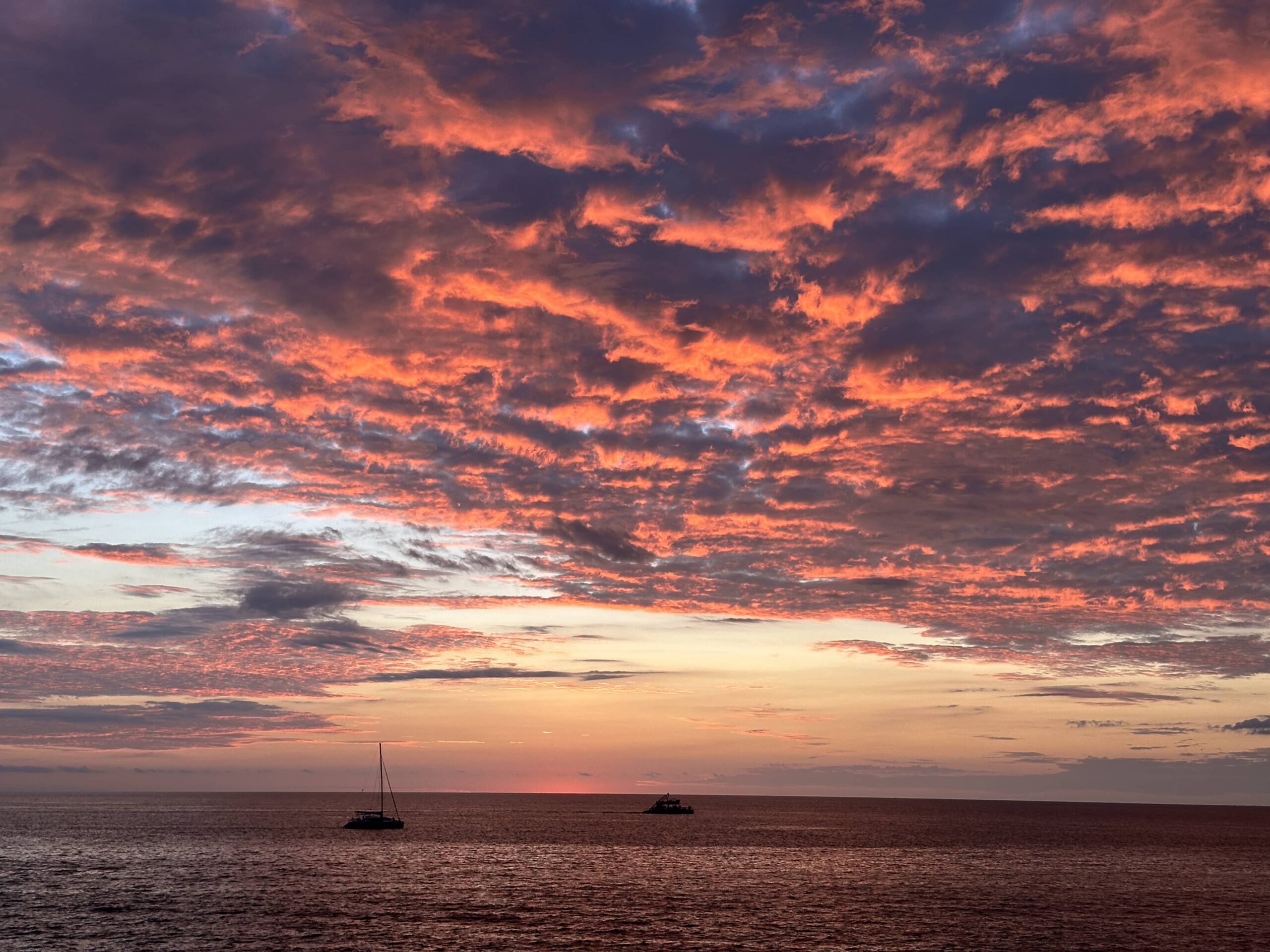 Colorful sunset sky over Costa Rica beach and ocean